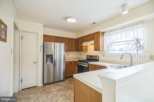 56 Ridgewood Way, Burlington, NJ 08016 - kitchen with stainless steel appliances, a sink, under cabinet range hood, light countertops, and brown cabinetry