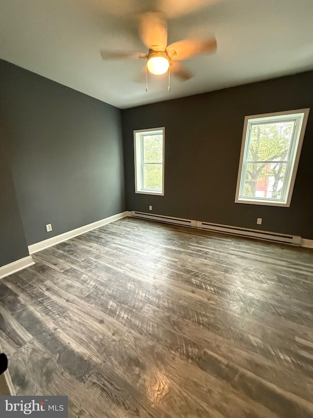 2324 N Lambert St, Philadelphia, PA 19132 - unfurnished room featuring a baseboard heating unit, ceiling fan, wood finished floors, and baseboards