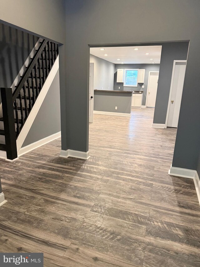 2324 N Lambert St, Philadelphia, PA 19132 - unfurnished living room with wood finished floors, baseboards, stairs, and recessed lighting