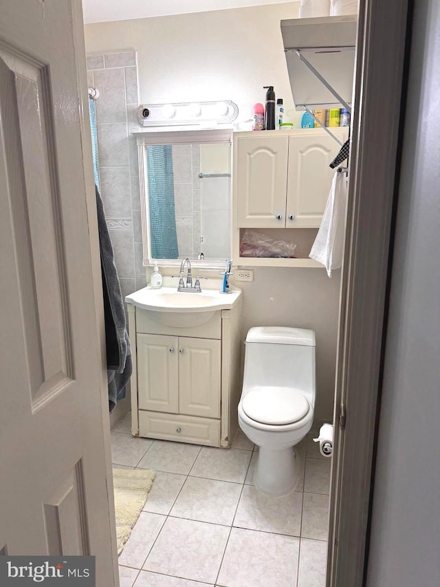 7332 Lee Hwy Unit 201, Falls Church, VA 22046 - bathroom with tile patterned floors, vanity, and toilet