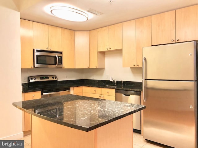 155 Potomac Psge Unit 634, Oxon Hill, MD 20745 - kitchen with appliances with stainless steel finishes, light tile patterned floors, dark stone countertops, and a sink