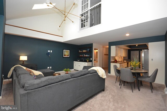 138 Pepperton Ct, Lititz, PA 17543 - living area with a towering ceiling, a chandelier, light carpet, and a skylight
