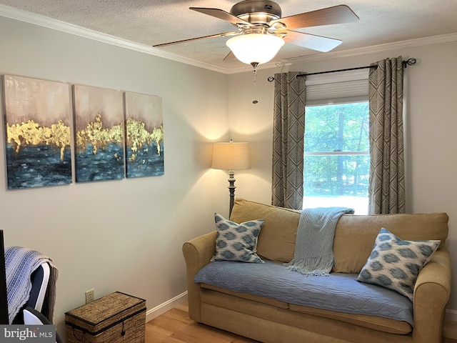 347 Lakewood Cir, Mineral, VA 23117 - living room featuring wood finished floors, crown molding, ceiling fan, a textured ceiling, and baseboards