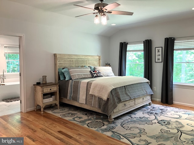 347 Lakewood Cir, Mineral, VA 23117 - bedroom with light wood-type flooring, vaulted ceiling, and a ceiling fan