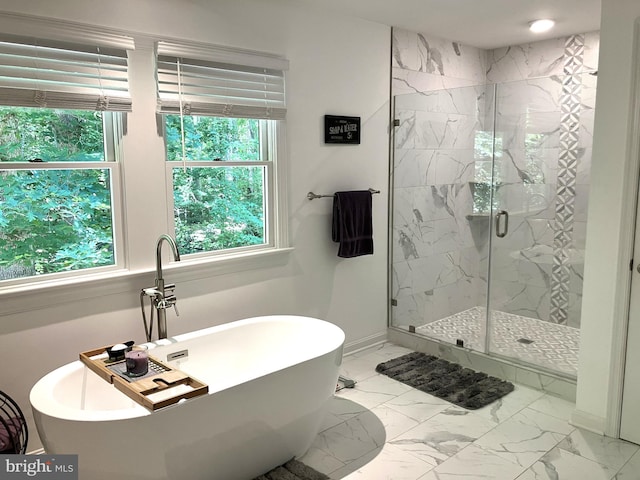 347 Lakewood Cir, Mineral, VA 23117 - bathroom with a marble finish shower, a freestanding bath, marble look tiles, and baseboards