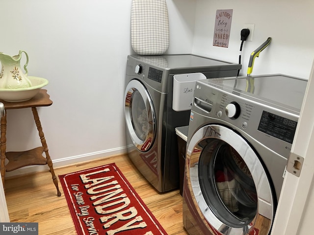 347 Lakewood Cir, Mineral, VA 23117 - washroom featuring washer and dryer, light wood-style floors, and baseboards