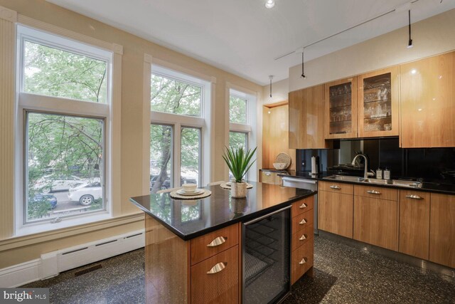1752 17th St NW, Washington, DC 20009 - kitchen featuring wine cooler, backsplash, brown cabinetry, and glass insert cabinets
