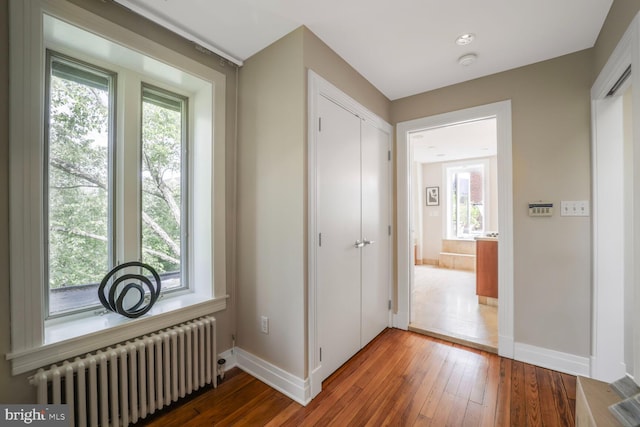 1752 17th St NW, Washington, DC 20009 - hallway featuring radiator heating unit, baseboards, and healthy amount of natural light