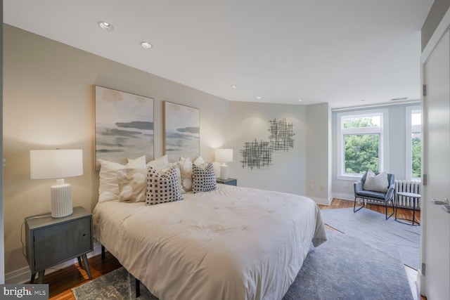1752 17th St NW, Washington, DC 20009 - bedroom with wood finished floors, radiator heating unit, baseboards, and recessed lighting
