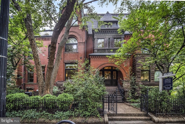 1752 17th St NW, Washington, DC 20009 - tudor-style house featuring a fenced front yard, brick siding, and a gate