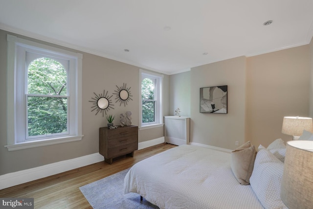 1752 17th St NW, Washington, DC 20009 - bedroom with wood finished floors, baseboards, and ornamental molding
