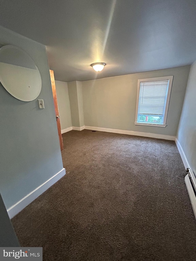 2229 Memphis St, Philadelphia, PA 19125 - unfurnished room with dark colored carpet and baseboards