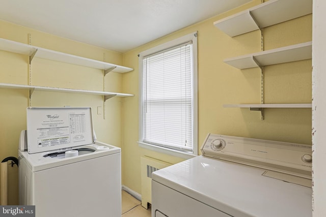 218 N Hammonds Ferry Rd, Linthicum Heights, MD 21090 - laundry room with separate washer and dryer, light tile patterned flooring, and baseboards