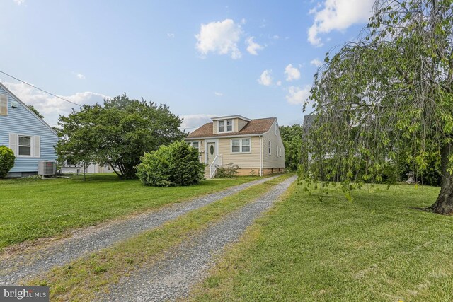 218 N Hammonds Ferry Rd, Linthicum Heights, MD 21090 - view of front of house featuring driveway, a front yard, and central AC unit