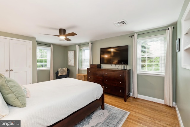511 Wilton Rd, Towson, MD 21286 - bedroom featuring light wood finished floors, baseboards, multiple windows, and a ceiling fan