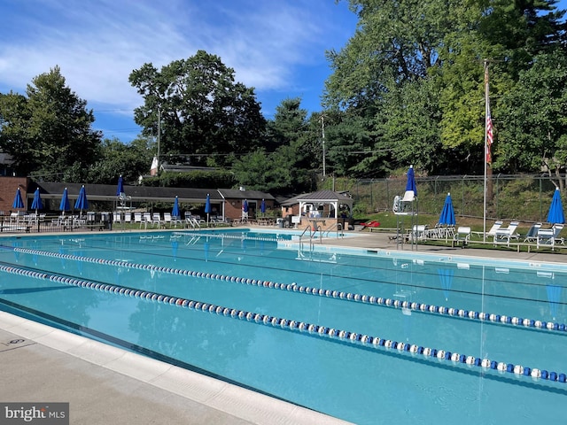 511 Wilton Rd, Towson, MD 21286 - community pool featuring a patio area and view of wooded area