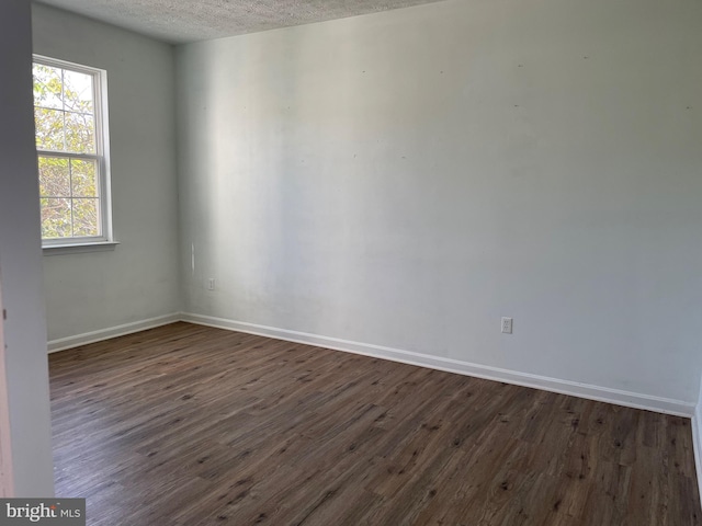 2974 Corona Ct, Manchester, MD 21102 - empty room featuring dark wood finished floors, a textured ceiling, and baseboards