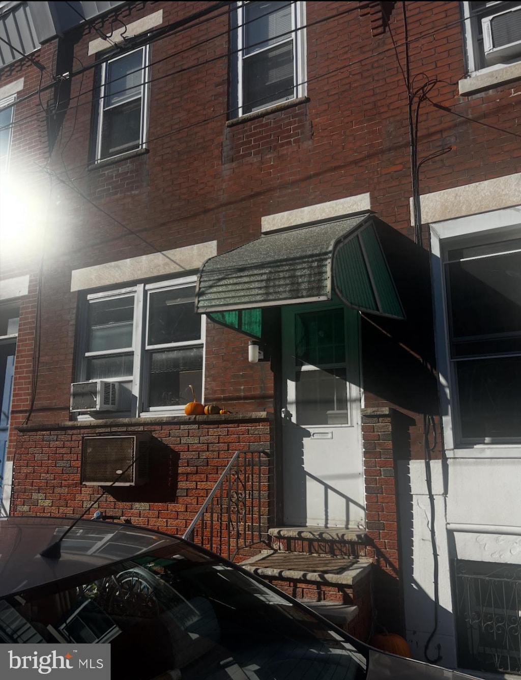 2024 S Bouvier St, Philadelphia, PA 19145 - view of side of home with brick siding and cooling unit