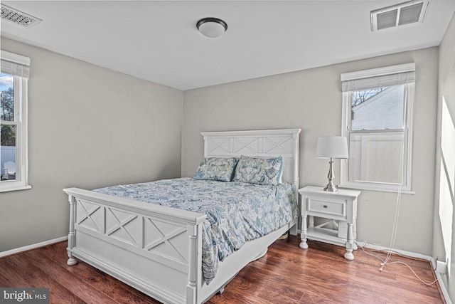 1224 Mercer Dr, Haddonfield, NJ 08033 - bedroom with wood finished floors, multiple windows, and baseboards