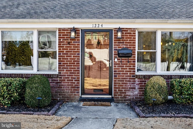 1224 Mercer Dr, Haddonfield, NJ 08033 - doorway to property with roof with shingles and brick siding