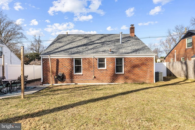 1224 Mercer Dr, Haddonfield, NJ 08033 - back of house with roof with shingles, brick siding, a chimney, and a patio