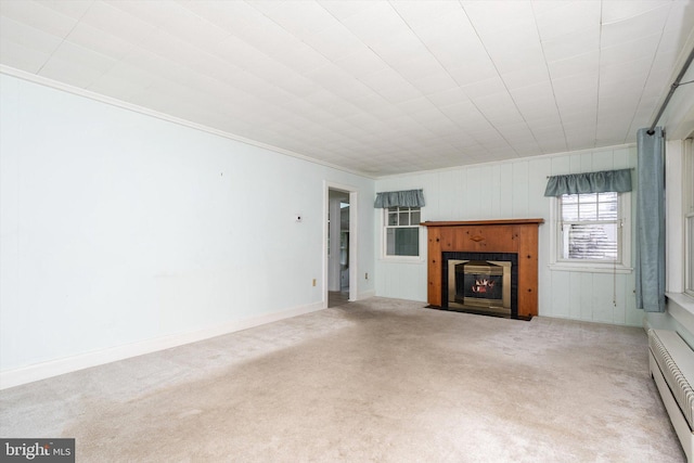 1010 Hampton Dr, Eastampton, NJ 08060 - unfurnished living room with a baseboard radiator, carpet, a fireplace with flush hearth, crown molding, and baseboards