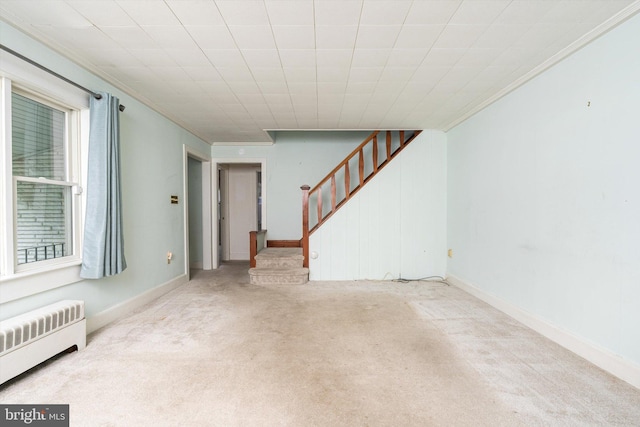 1010 Hampton Dr, Eastampton, NJ 08060 - unfurnished living room with radiator heating unit, ornamental molding, carpet floors, stairs, and baseboards