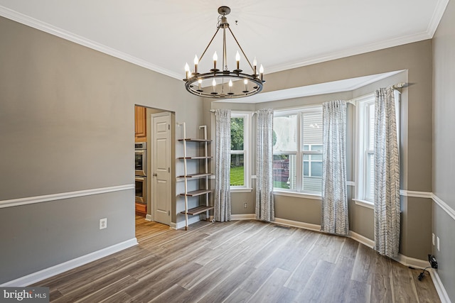 46825 Northbrook Way, Sterling, VA 20164 - unfurnished dining area featuring a chandelier, wood finished floors, crown molding, and baseboards