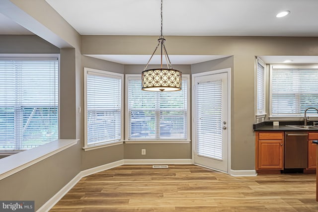 46825 Northbrook Way, Sterling, VA 20164 - unfurnished dining area featuring light wood finished floors, baseboards, healthy amount of natural light, and recessed lighting