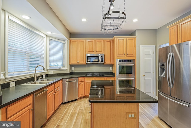 46825 Northbrook Way, Sterling, VA 20164 - kitchen featuring stainless steel appliances, a sink, light wood finished floors, a center island, and recessed lighting