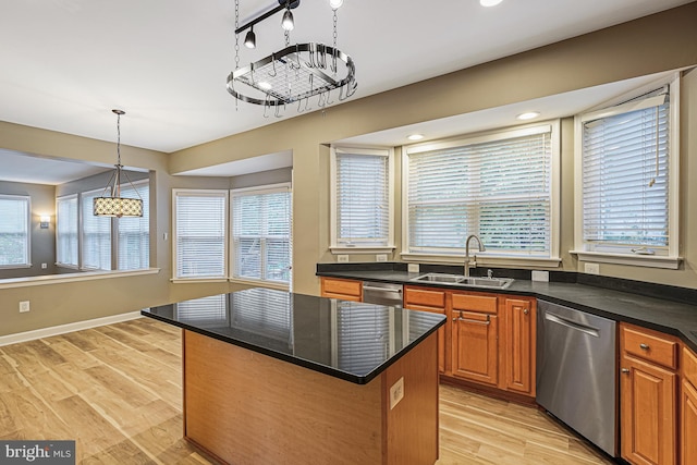 46825 Northbrook Way, Sterling, VA 20164 - kitchen with stainless steel dishwasher, a sink, a kitchen island, light wood-style flooring, and brown cabinetry