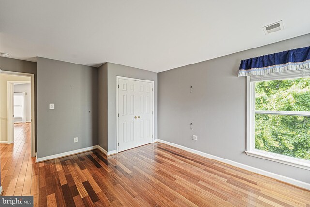 46825 Northbrook Way, Sterling, VA 20164 - unfurnished bedroom featuring wood finished floors, baseboards, and a closet