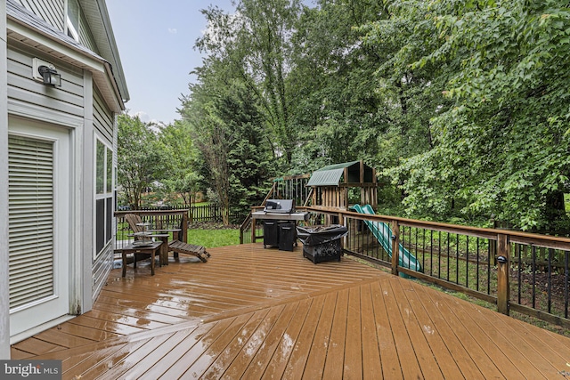 46825 Northbrook Way, Sterling, VA 20164 - wooden terrace with a playground and view of wooded area