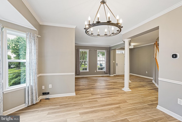 46825 Northbrook Way, Sterling, VA 20164 - entryway with plenty of natural light, a chandelier, ornate columns, light wood finished floors, and ornamental molding
