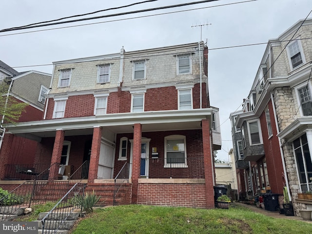 1515 N Franklin St, Wilmington, DE 19806 - townhome / multi-family property with brick siding, mansard roof, and a porch