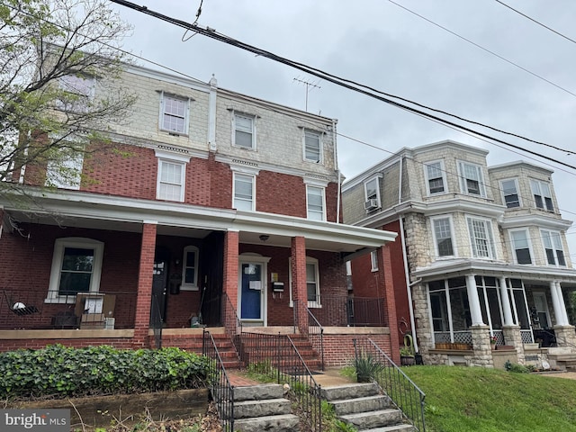 1515 N Franklin St, Wilmington, DE 19806 - townhome / multi-family property featuring covered porch, brick siding, and mansard roof