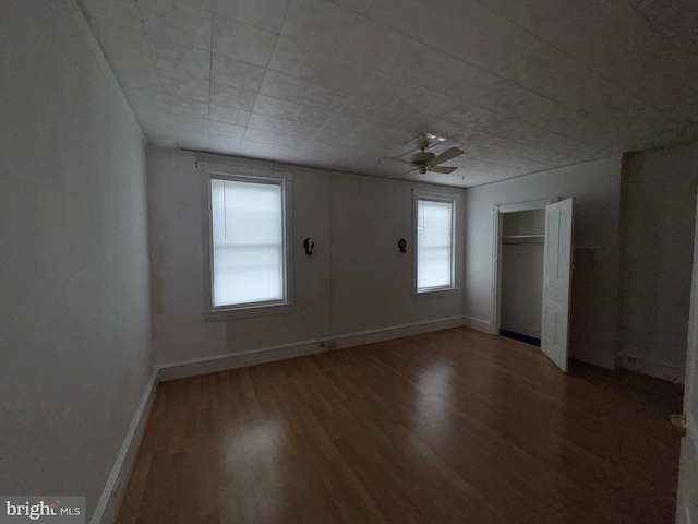 1515 N Franklin St, Wilmington, DE 19806 - unfurnished bedroom with wood finished floors, baseboards, a closet, and ceiling fan