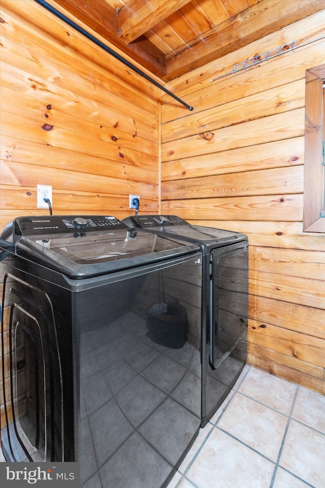 26 Wallamsey Ln, Chesapeake City, MD 21915 - laundry room featuring separate washer and dryer, tile patterned flooring, and wooden walls