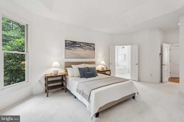 8109 Crooked Oaks Ct, Gainesville, VA 20155 - bedroom with light colored carpet, ensuite bath, and baseboards