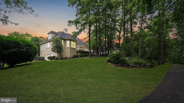 8109 Crooked Oaks Ct, Gainesville, VA 20155 - yard at dusk featuring a lawn and an attached garage