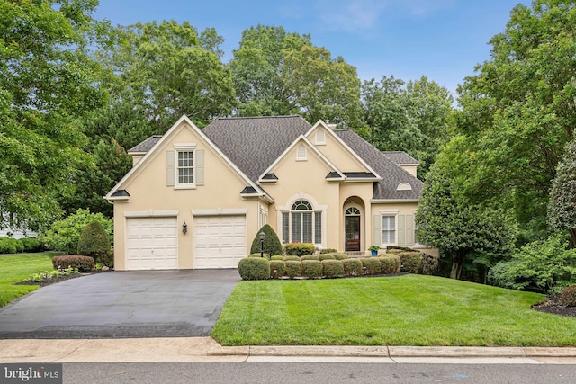 8109 Crooked Oaks Ct, Gainesville, VA 20155 - traditional-style home featuring stucco siding, asphalt driveway, a front lawn, and roof with shingles