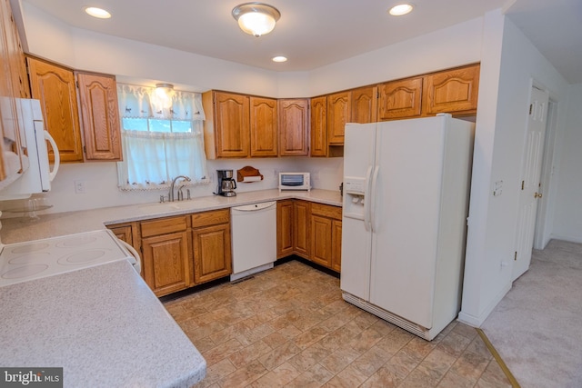 27836 Clearwater Ct, Salisbury, MD 21801 - kitchen featuring white appliances, brown cabinets, light countertops, recessed lighting, and light stone finish floors