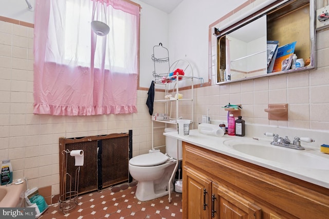 2024 Mifflin St, Philadelphia, PA 19145 - bathroom featuring tile walls, toilet, and vanity
