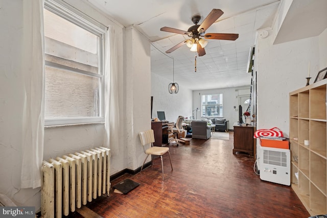 2024 Mifflin St, Philadelphia, PA 19145 - living area featuring radiator, wood finished floors, a desk, and ceiling fan