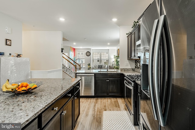 340 Dawson Pl, Downingtown, PA 19335 - kitchen with stainless steel appliances, light wood finished floors, light stone counters, recessed lighting, and a sink