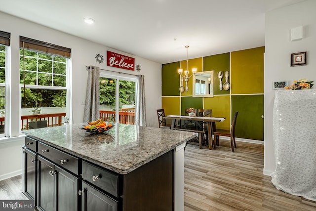 340 Dawson Pl, Downingtown, PA 19335 - kitchen featuring light wood finished floors, a chandelier, light stone counters, decorative light fixtures, and baseboards