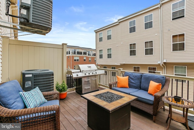 4631 Hudson St, Baltimore, MD 21224 - wooden terrace with area for grilling, central AC unit, and an outdoor living space with a fire pit