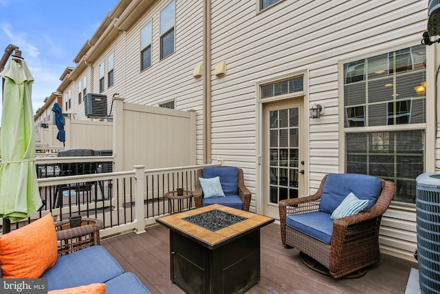 4631 Hudson St, Baltimore, MD 21224 - wooden deck with an outdoor fire pit and cooling unit