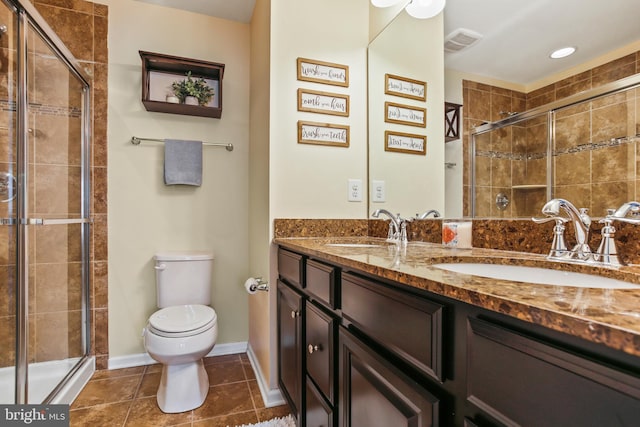 4631 Hudson St, Baltimore, MD 21224 - full bath with toilet, double vanity, a shower stall, tile patterned flooring, and baseboards
