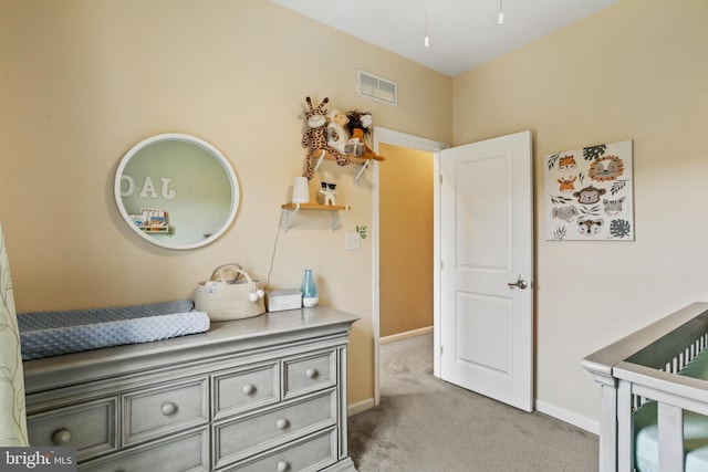 4631 Hudson St, Baltimore, MD 21224 - bedroom featuring light colored carpet, baseboards, and a nursery area